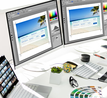 Several monitors editing a website at Creativa Promotions