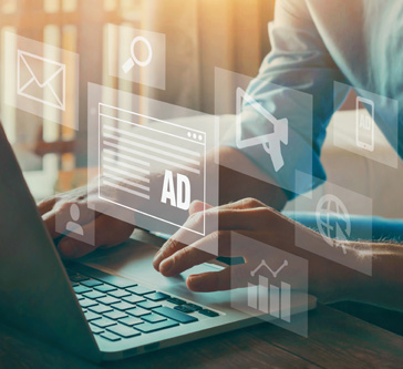 Absract image of man working on a laptop with 'ad' image overlayed